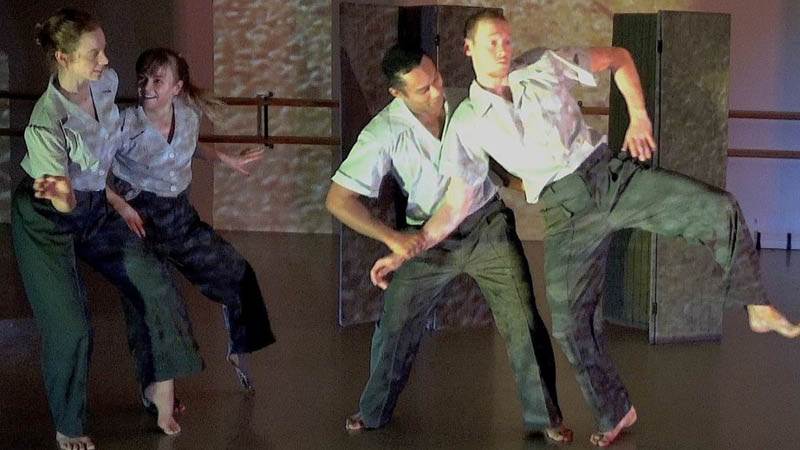 Enigma, två kvinnor och två män som dansar på scen