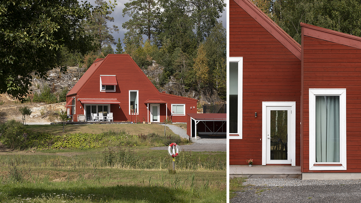 Röd trävilla med detaljer i vitt trä