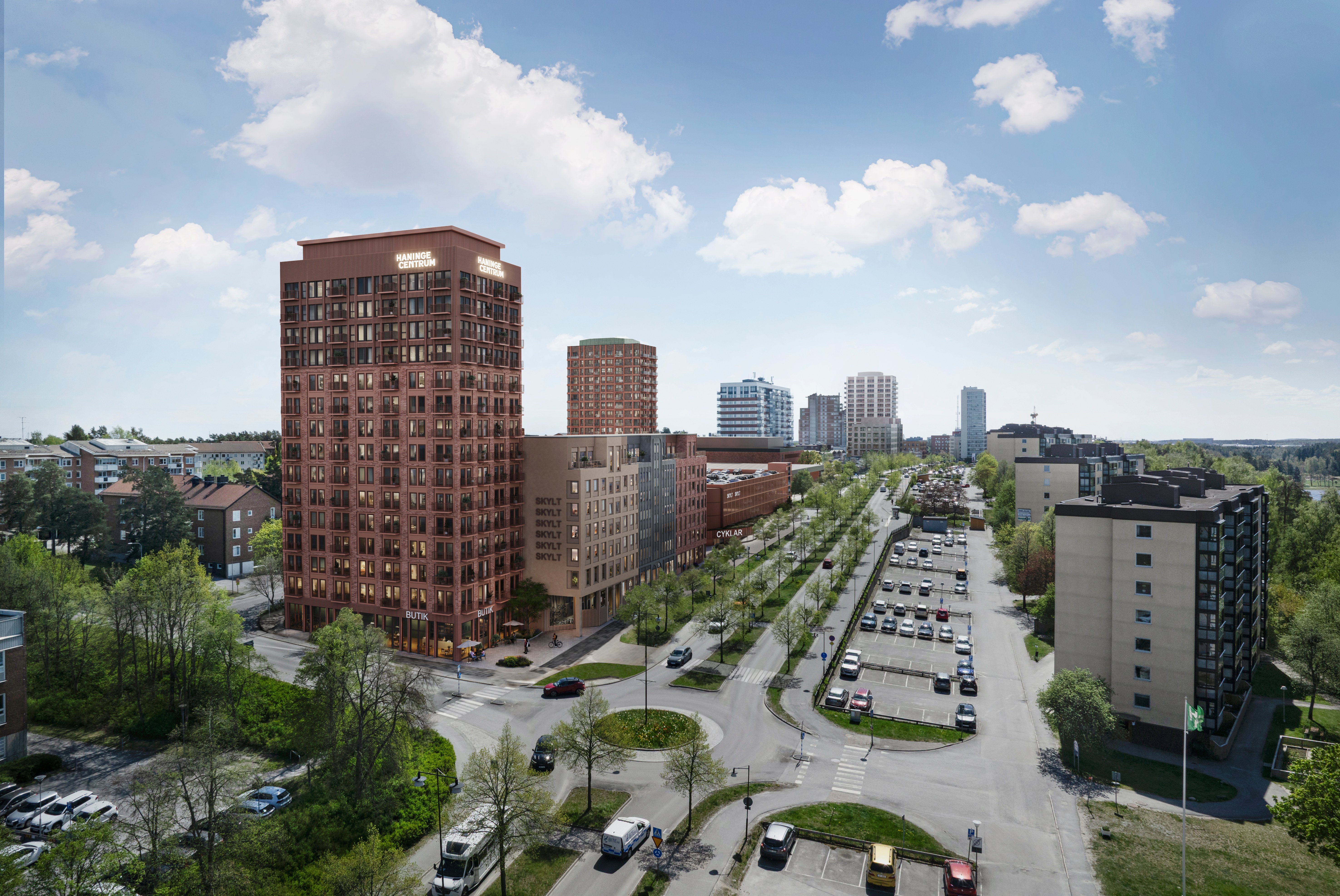 Visionsbild över det nya norra bostadskvarteret. På bilden syns ett högre hus med tegelfasad och ytterligare byggnader nedanför.